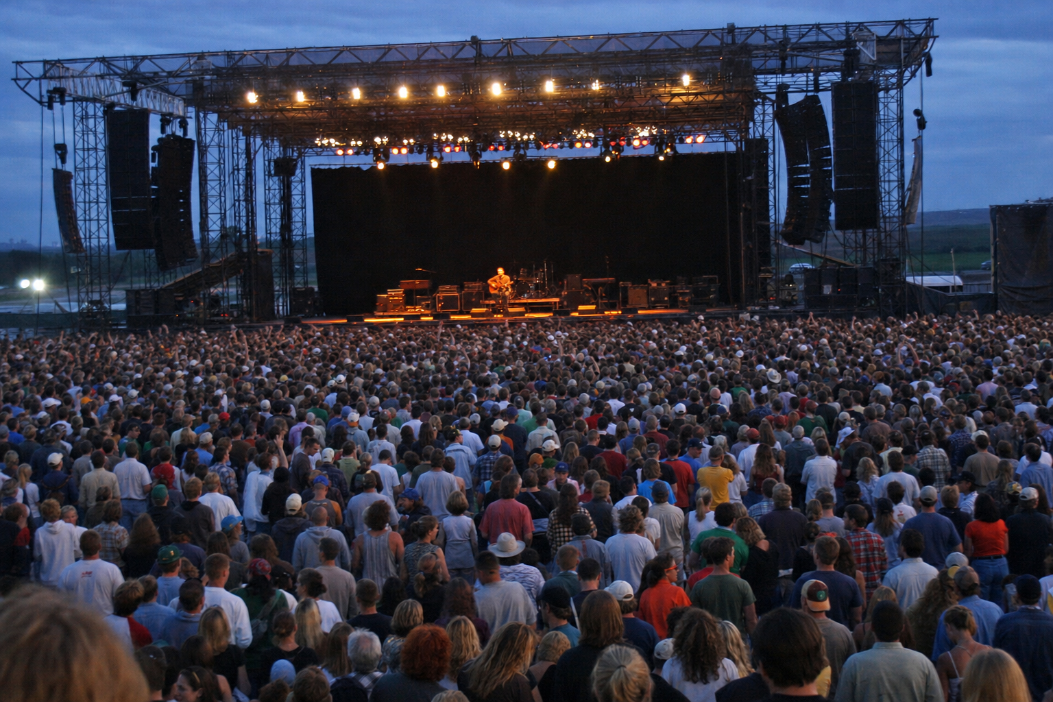 Artist recreation of Brad Nietfeldt performing at Comstock Rock before a large festival crowd